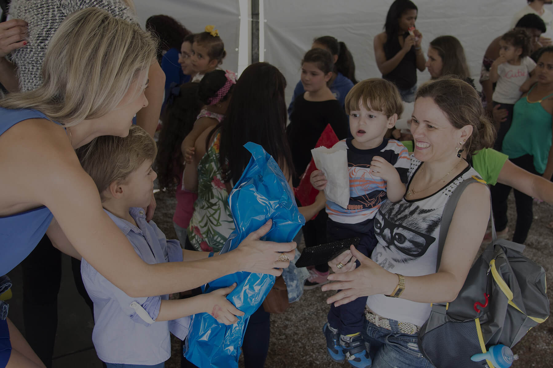 Volunteers and families at a community event